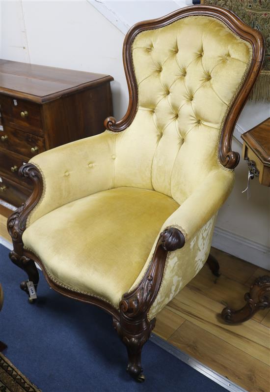 A Victorian mahogany buttonback armchair, upholstered in gold velvet